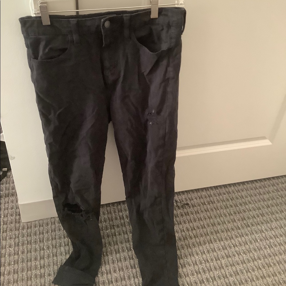 Black jeans with holes on knee